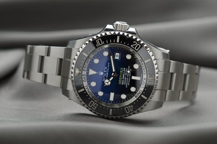 Rolex watch on desk